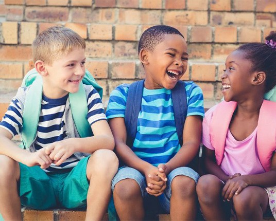 Group of happy, laughing school children