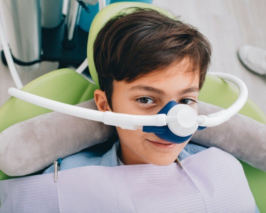 Child with nitrous oxide dental sedation mask
